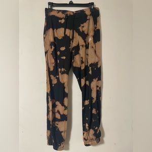 Women’s Nike joggers, bleach tie-dye.